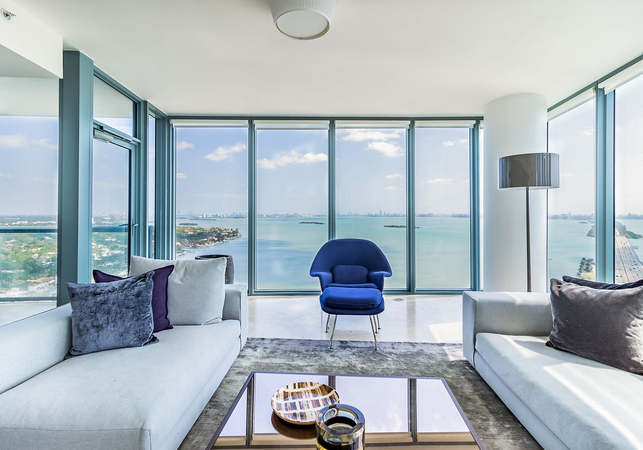 Modern high-rise living room with waterfront view